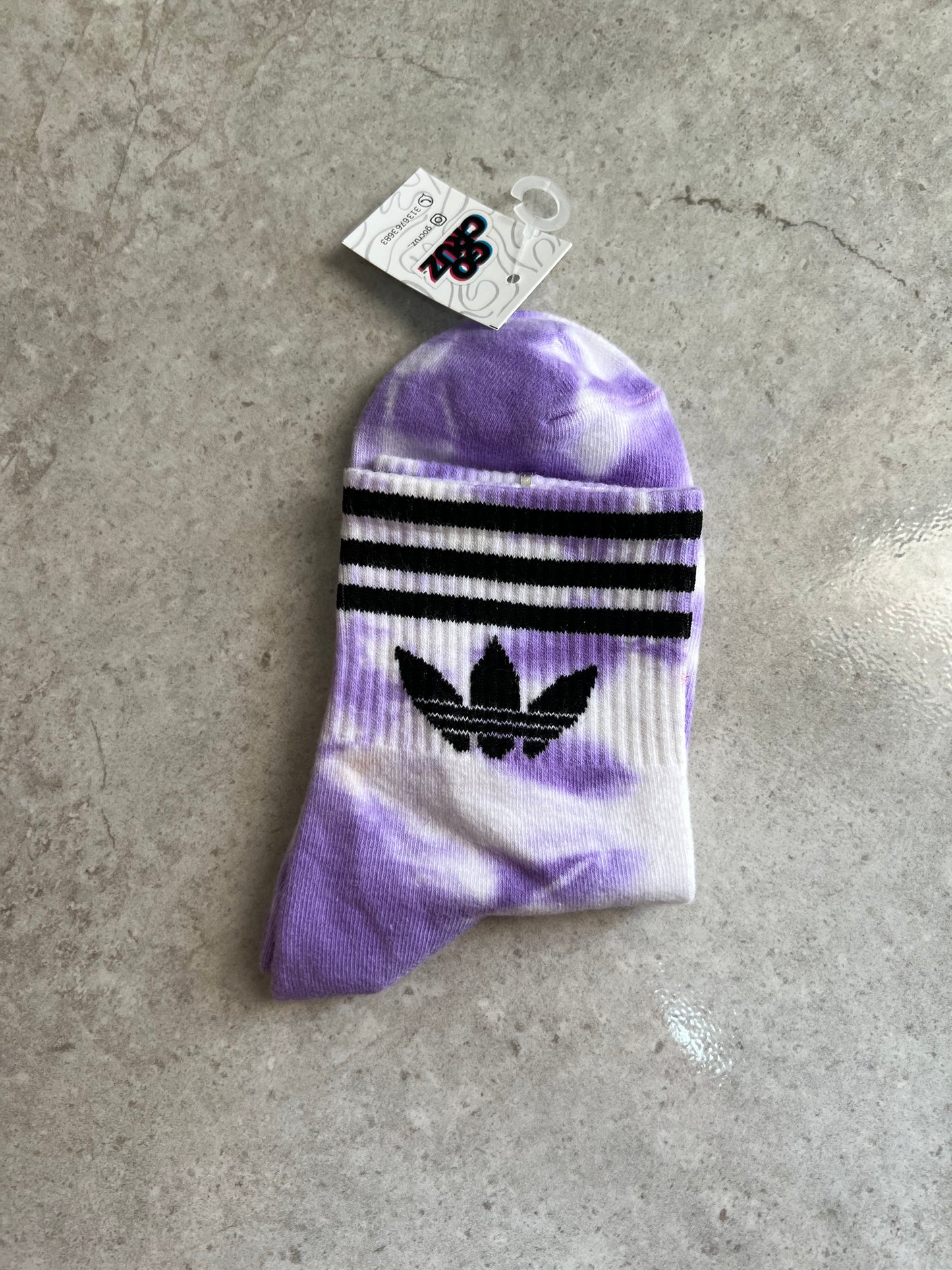 Adidas manchas moradas